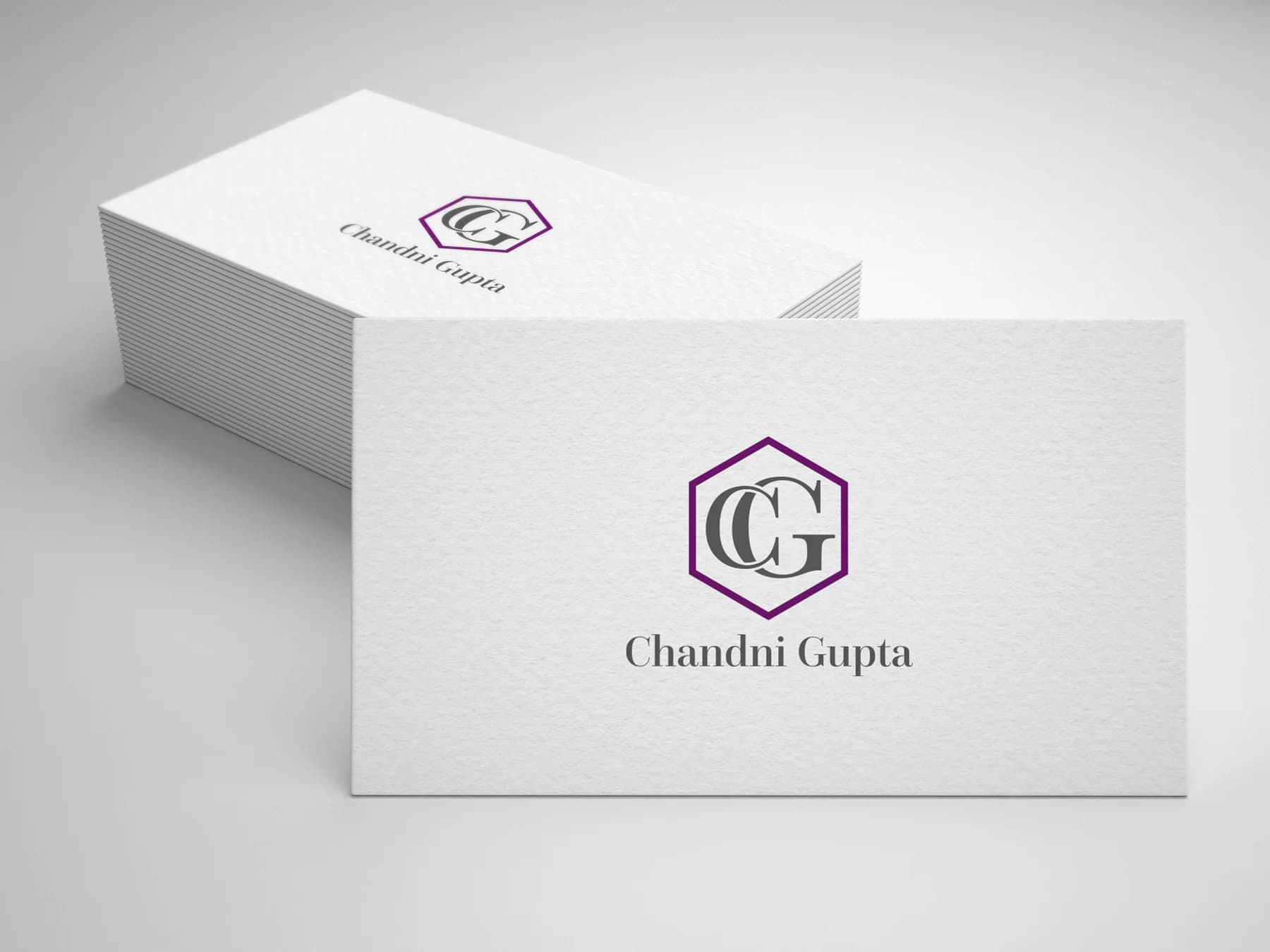 Chandni Gupta monogram identity applied to white textured business cards